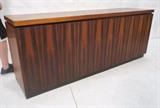 Lot 509:  American Modern Walnut 4 Door Credenza Sideboard. Black skirted base. One side has two drawers. One side has shelf. : Dimensions:  H: 29.25 inches: W: 74 inches: D: 19 inches --- 
