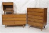 Lot 517:  3pc American Modern Bedroom Set. Night Stand. High & Low Dresser. Horizontal wood pulls with wrapped rattan elements. Raised on legs: Dimensions:  H: 43.5 inches: W: 36 inches: D: 19 inches --- 