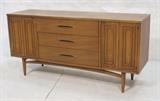 Lot 518:  American Modern Walnut 2 Door 3 Drawer Credenza Sideboard. Raised on legs. : Dimensions:  H: 28.5 inches: W: 58 inches: D: 17 inches --- 