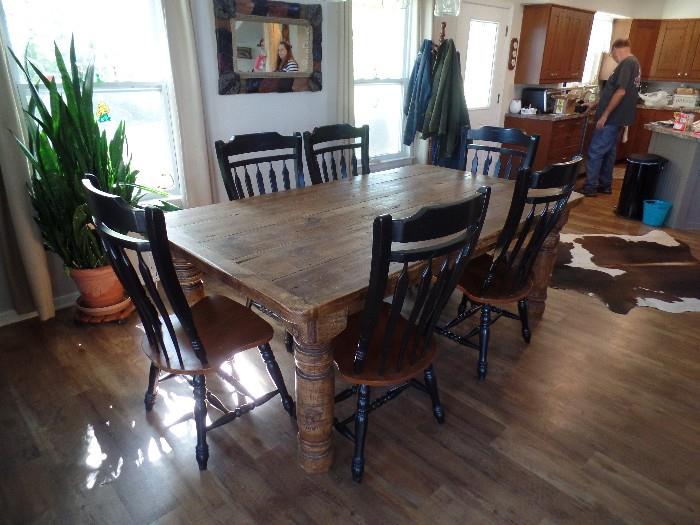 Beautiful heavy Wood Table with large legs, plus Six (8) heavy built matching Chairs. Entire set is like brand new!! Came from philbecks furniture in Forney cost over $4800 new selling for $2500 table is made from old railroad car have to see to beleive