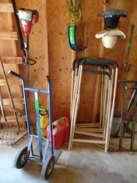 Weed Eater, Two Wheel Dollie, Gas Cans, Saw Horses, Swing and Yard Tools.