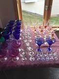 Various sets of colored glassware....