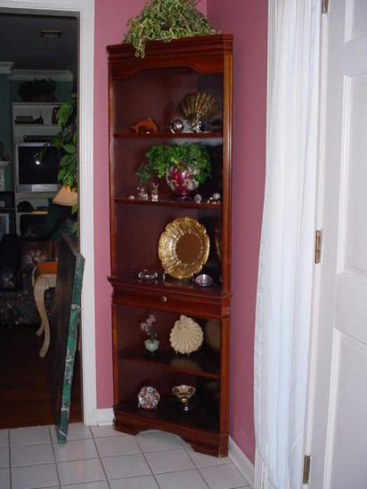 Corner cabinet full of fine porcelains, and glass
