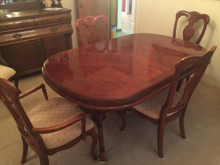 Very nice formal dining table with 4 chairs. Barely used!