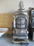Cribben & Sexton parlor coal stove, Imperial Universal, solid nickel w/ dragon heads
