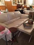 Cream sofa, painted coffee table, great detail, Military books, art works