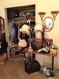 Antique sewing table, Vintage hats, Ladies night ware, Gentleman's suits, they are great, hats and travel cases and bags, slippers and casual shoes, vintage dolls, T-shirts. We also have men's clothes on a rack in the garage. 