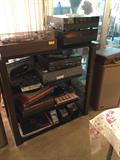 Glass and metal entertainment shelving, electronics, vintage 33's LP's, cassettes, 45's