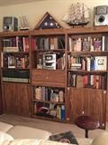 These bookcases are in three pieces and are priced individually, music system with two speakers, lots of books, model ships, flags