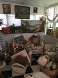 In the Studio, Wicker loveseat, chair and rocker, small table, other wicker items, art works, vintage lamps