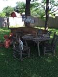 In the back garden, Twig table with four chairs, lots of garden stuff