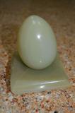 Jade egg on base.