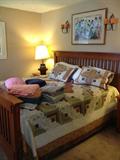 King size mission style bed with 1 year old mattresses.
