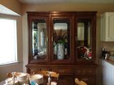 Beautiful oak lighted china cabinet.