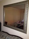 Beveled large mirror in silver trim.