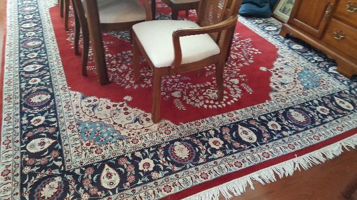 9'3"x12'3" fine Pakistani Persian, Kerman design, hand knotted 16/18 quality rug, red open field with center medallion. Ivory and Navy design. 
