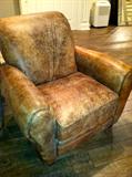 Pair of brown distressed leather recliners.