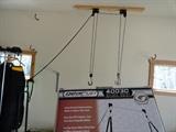 The bike hoist on garage ceiling stays with house. GearUp 40030 Deluxe Bike Hoist