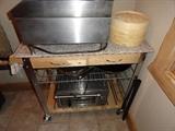 Granite top utility cart on casters. Breville Convection Toaster Oven on bottom.