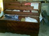 Cedar chest and linens.