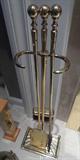 Brass fireplace tools.