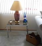 Chrome and glass top end table that match coffee table.