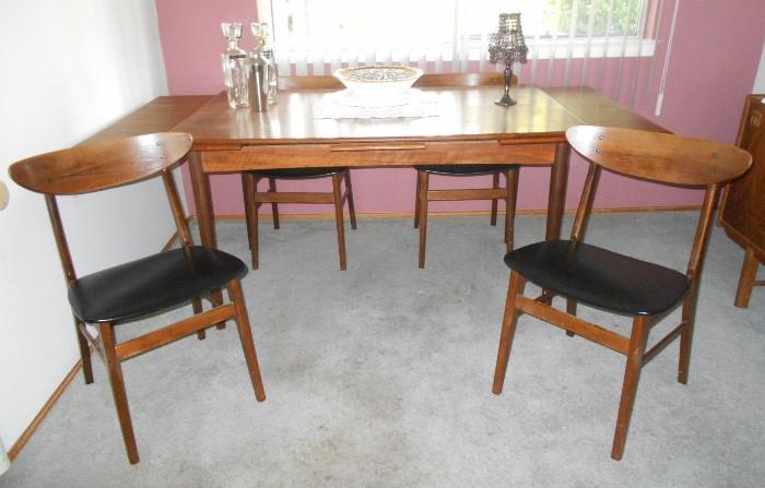 Danish mid-century dining set.  Table has pull out extensions to expand table.