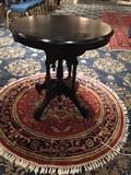 table with round rug under