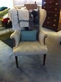 Wingback Chair with decorative pillows and throws