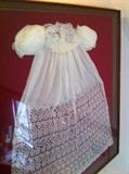 Beautifully framed Hand-made Baby Dress