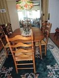 Thomasville oval table with one leaf, 4 ladder-back chairs, 2 ladder-back arm chairs, wool rug