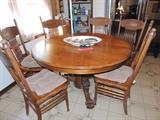 antique oak round table with paw feet six press back chairs