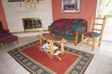 rustic sofa, coffee table, side chair, area rug