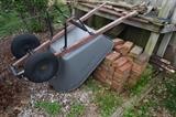 wheelbarrow and brick