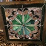 One of the several pieces of framed stain glass