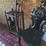 Antique umbrella/cane holder; one of several unique antique chairs