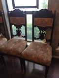 Two of four antique chairs