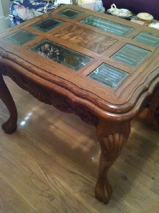 sturdy oak coffee or end table. carved clawed feet