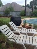 Pool side recliners and clay pots