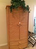 Wicker clothing armoire with storage below