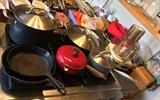 Pots and pans by Analon & Le Creuset, cast iron skillets by Wagner & Griswold, Cuisinart food processor (Model DLC-8F), wood recipe box