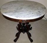 antique round table with white marble top