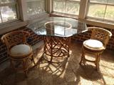 rattan kitchen / patio table and 2 chairs that swivel