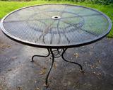 round black wrought iron patio table