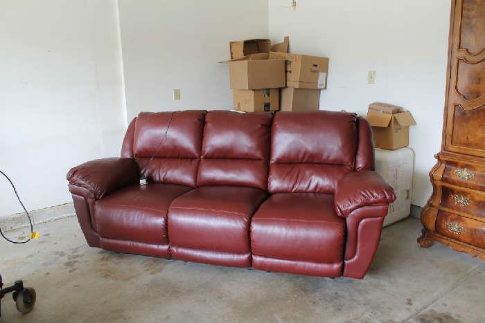 Fawx leather reclining both ends chair, middle folds down for table, also has message