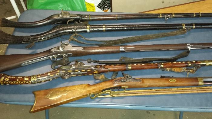 9 rifles total. Afghan/Arabic/India camel rifles, Springfield #1842 Armi Sport 69 cal., Thompson Center 54 cal. black powder
