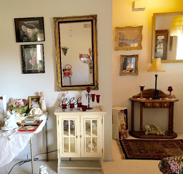 Darling wood two door cabinet..oak side table..numerous mirrors and pictures..