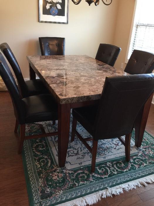 #23   Solid Granite Single Piece Top Kitchen Table with 6 leather Chairs       $600
#44   Green Machine Made Rug    $60   8x5.5