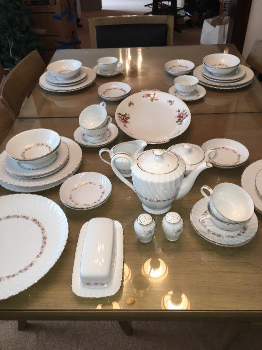This sweet China set sits atop a fabulous dinning table. This table is not only beautiful but sturdy and will hold-up over time!!! The glass sets this table apart. There are also extensions with the matching glass!!! Bonus!