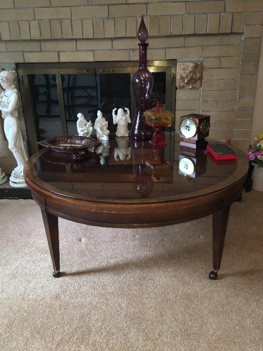 This is a beautiful inlaid, glass topped round coffee table. It's a must-see!!!